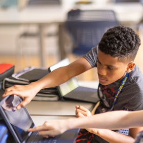 Student points at their tablet